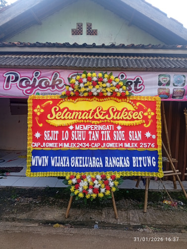 Karangan bunga papan selamat &sukses 